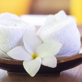 White cotton towel on table in the luxury hotel, welcome for guests